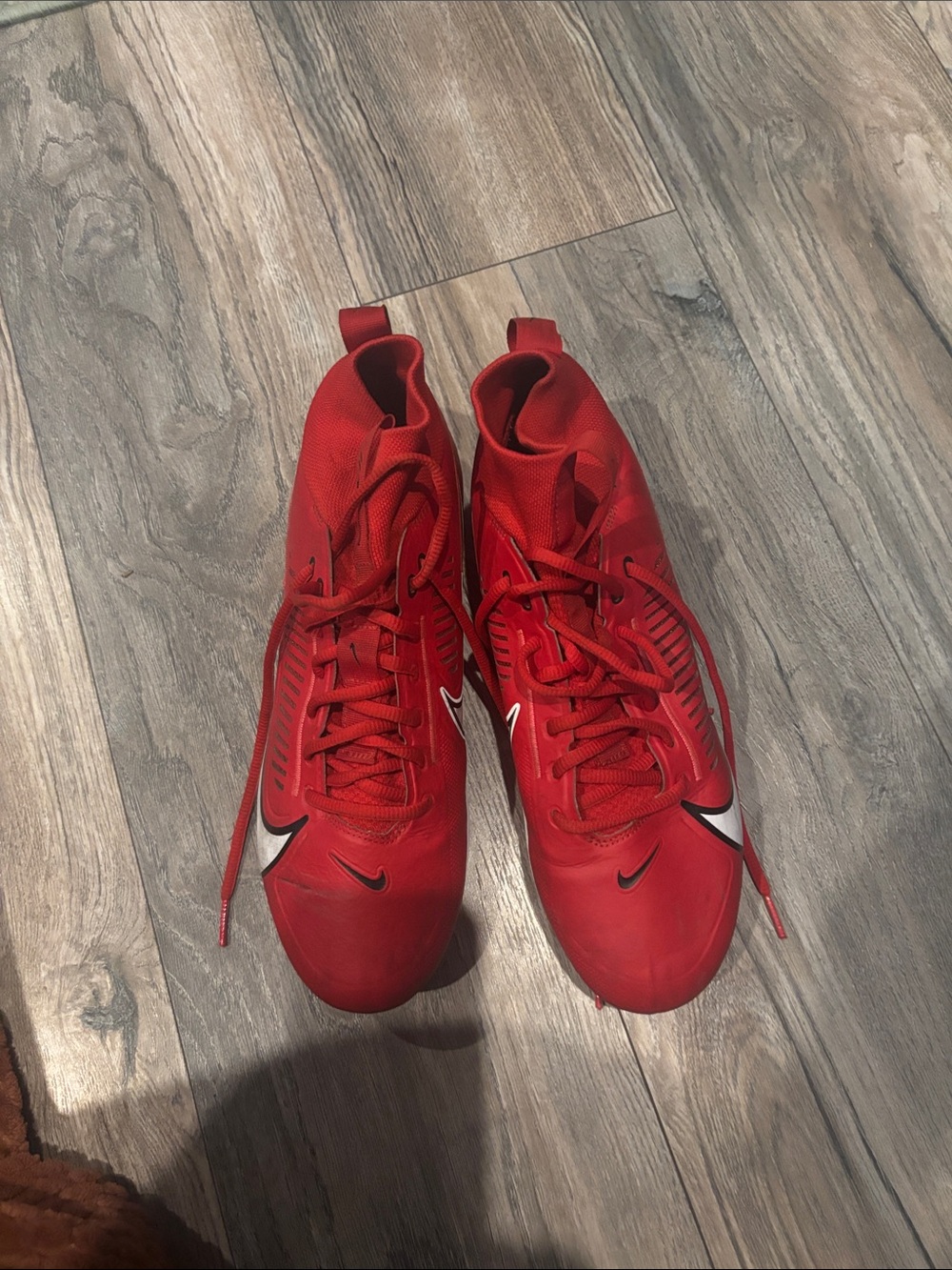 Nike Red Athletic Cleats with White Swoosh Accents